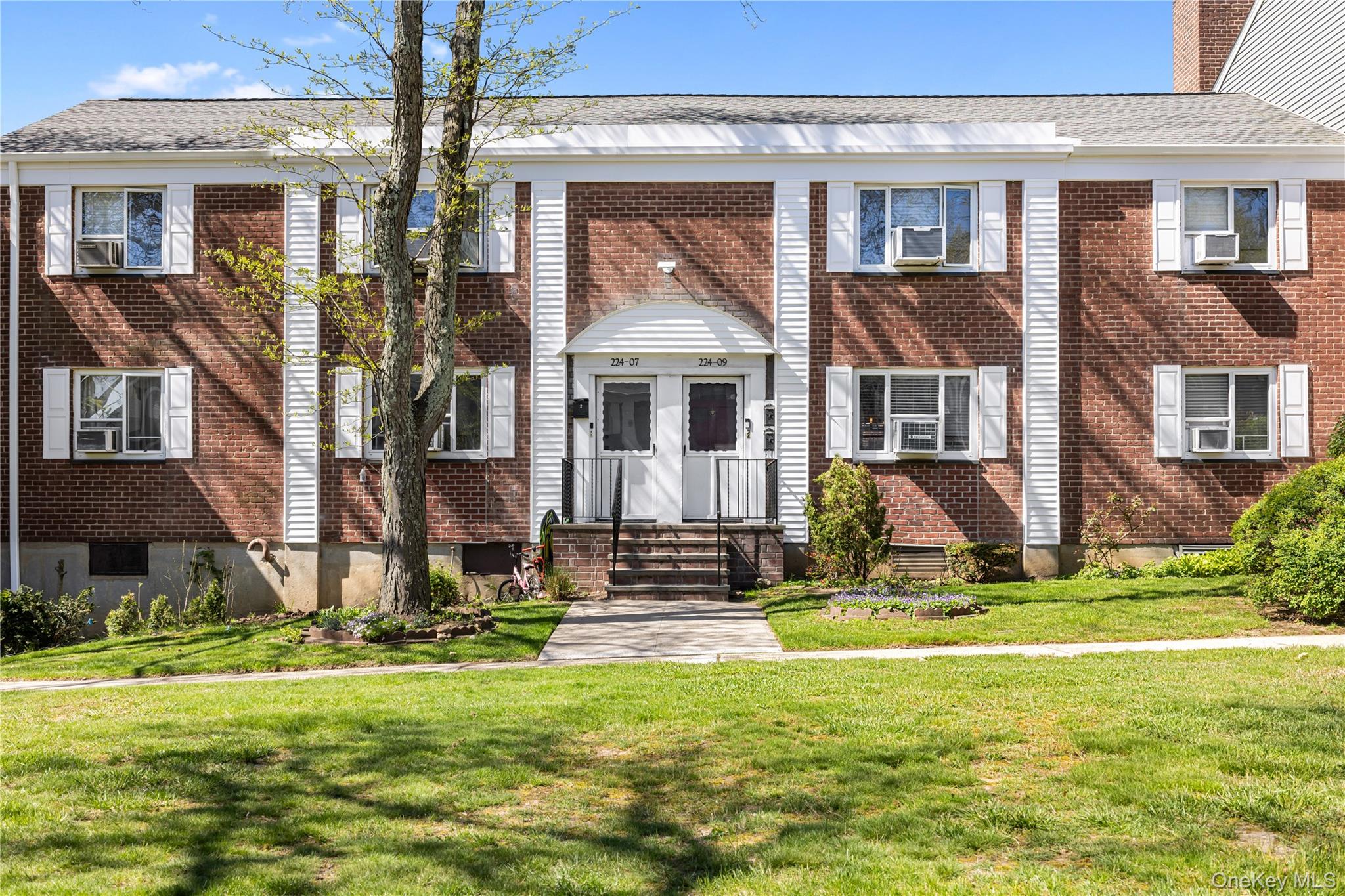 224-09 Manor Road, Unit LOWER) 2408 Queens, NY 11427 - Photo 20 of 20 a view of a house with a swimming pool