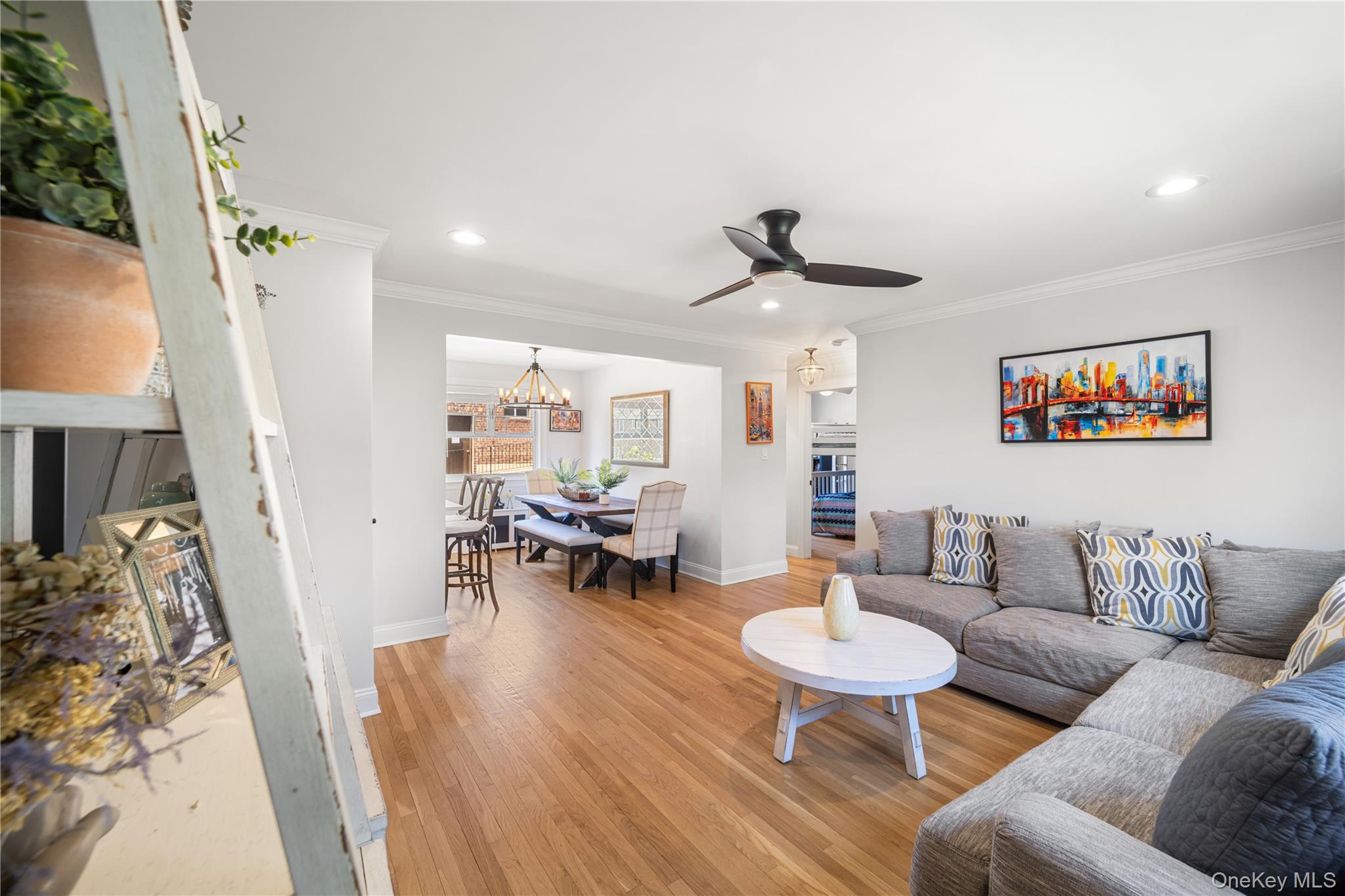 224-09 Manor Road, Unit LOWER) 2408 Queens, NY 11427 - Photo 3 of 20 a living room with furniture and a wooden floor