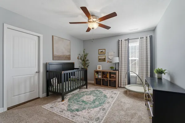 a bedroom with furniture and windows