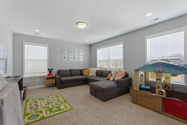 a living room with furniture and a window