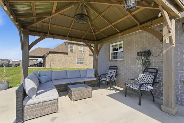 a outdoor living space with furniture and garden