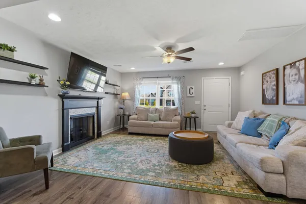 a living room with furniture and a fireplace