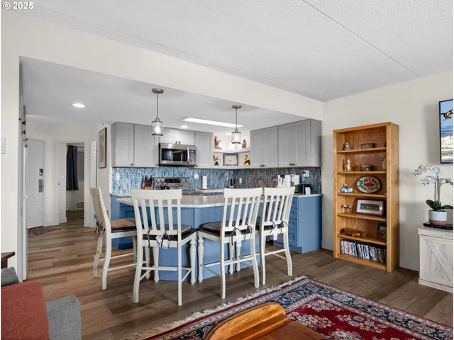 a view of a dining room with furniture and wooden floor