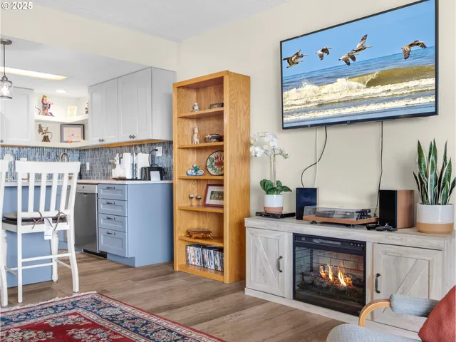 a kitchen with stainless steel appliances granite countertop a stove a microwave and cabinets