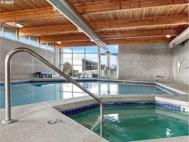 a view of swimming pool with a yard