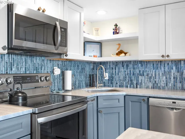 a kitchen with a sink and cabinets