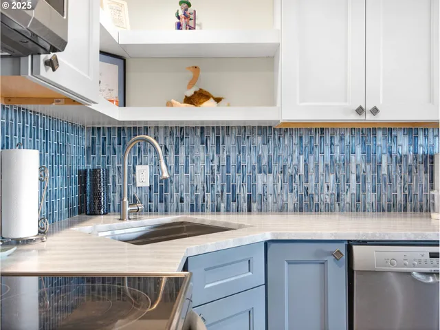 a kitchen with a sink and a refrigerator