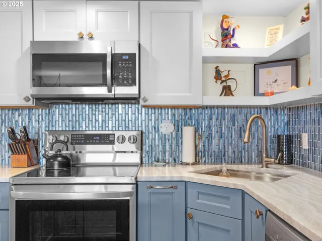 a kitchen with a stove and a microwave