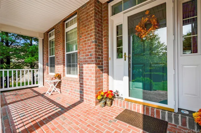 a balcony with wooden floor and outdoor space