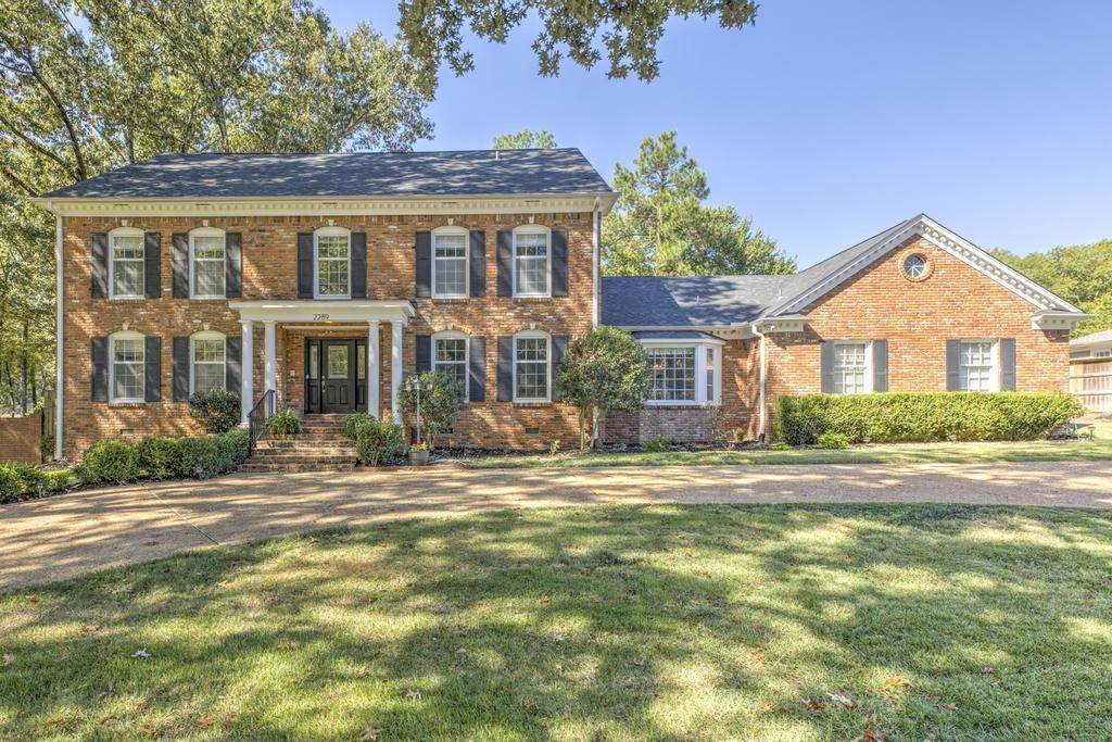 2289 Kirby Road Memphis, TN 38119 - Photo 1 of 35 a front view of a house with a yard