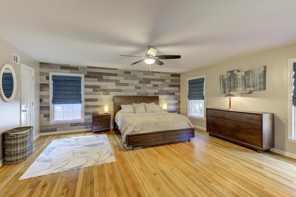 2289 Kirby Road Memphis, TN 38119 - Photo 16 of 35 a bedroom with a bed and a chandelier