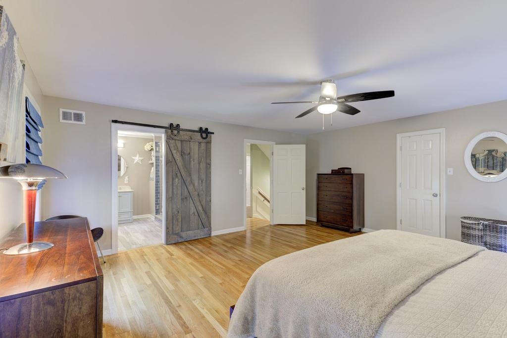 2289 Kirby Road Memphis, TN 38119 - Photo 17 of 35 a bedroom with a bed and a chandelier