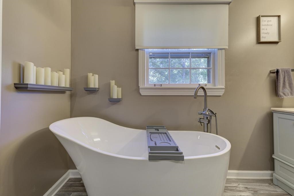 2289 Kirby Road Memphis, TN 38119 - Photo 18 of 35 a white bath tub sitting in a bathroom