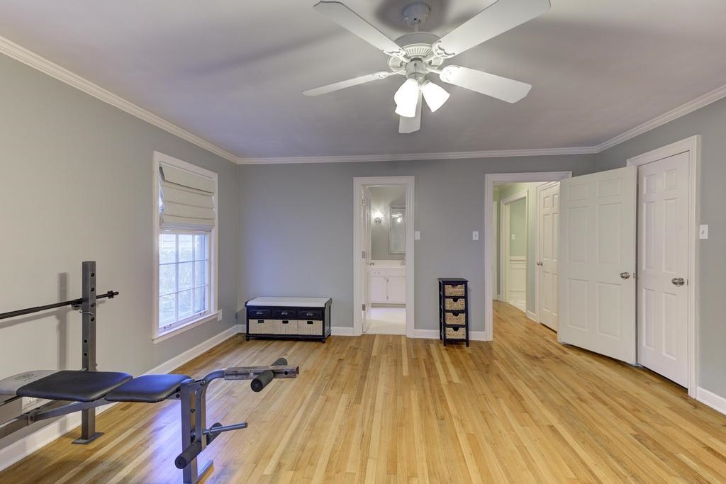 2289 Kirby Road Memphis, TN 38119 - Photo 23 of 35 a bedroom with a bed and wooden floor