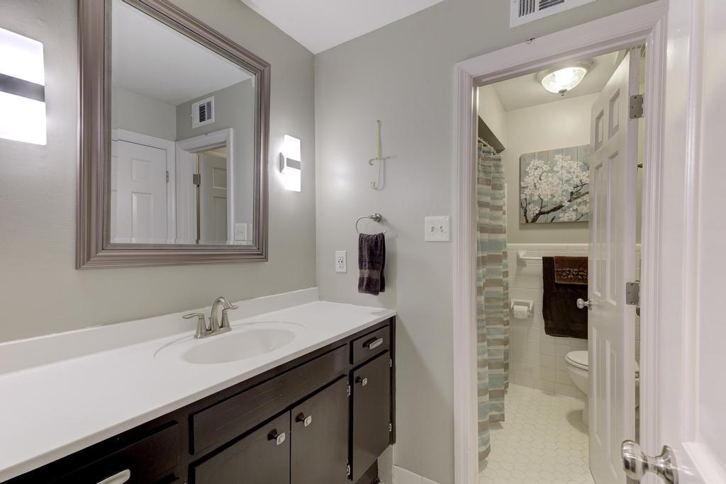 2289 Kirby Road Memphis, TN 38119 - Photo 28 of 35 a bathroom with a sink vanity and mirror
