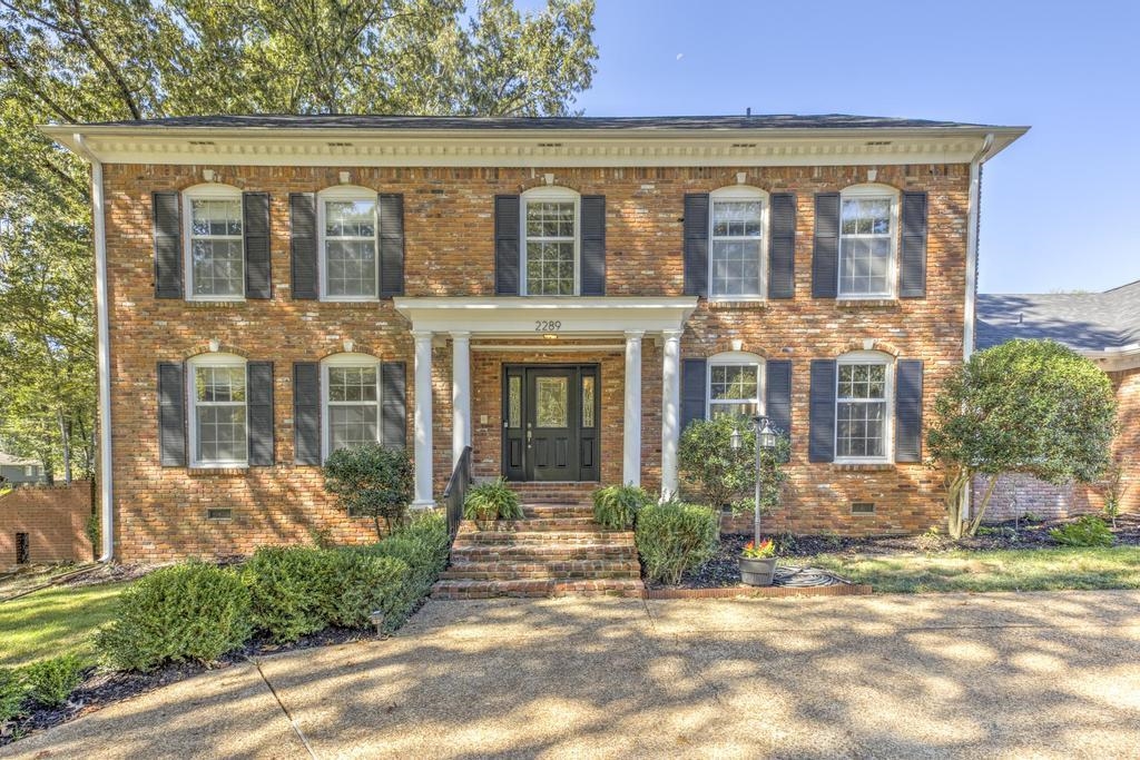 2289 Kirby Road Memphis, TN 38119 - Photo 33 of 35 front view of a brick house with a yard