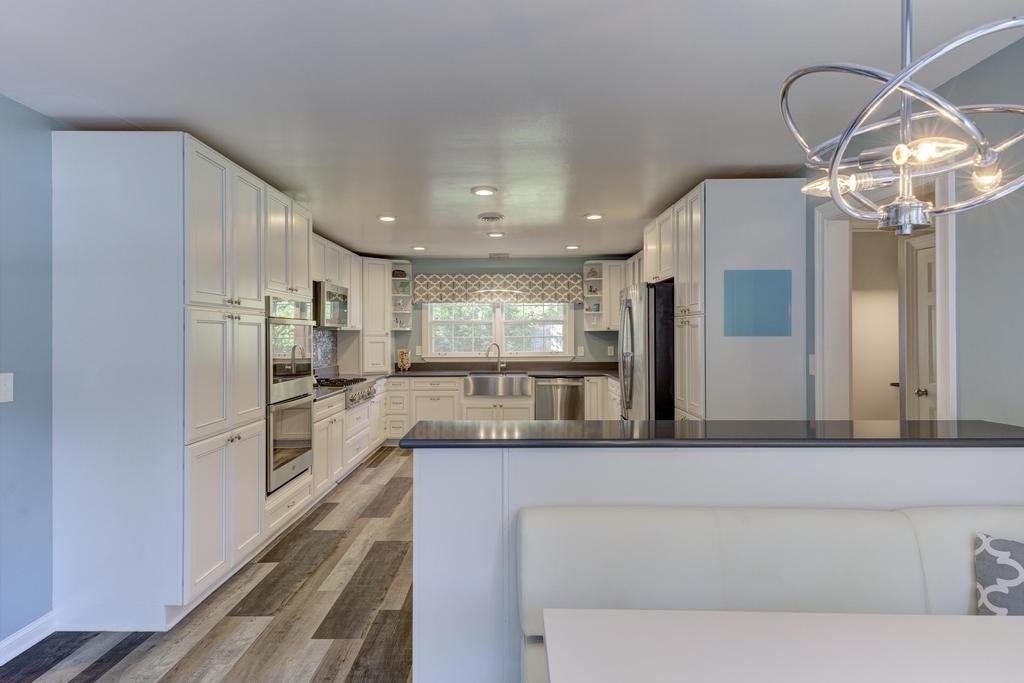 2289 Kirby Road Memphis, TN 38119 - Photo 10 of 35 a large kitchen with a large counter top appliances and cabinets