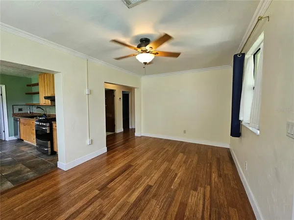 wooden floor in an empty room with a window