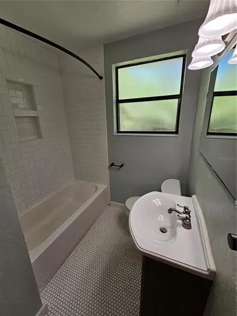 a bathroom with a sink and a bathtub