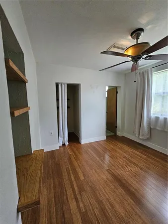 a view of a livingroom with a dishwasher and cabinets