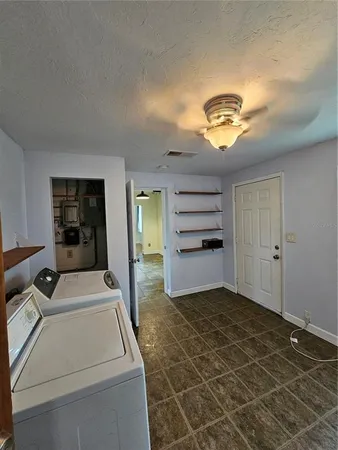 a room with a large window and pool table
