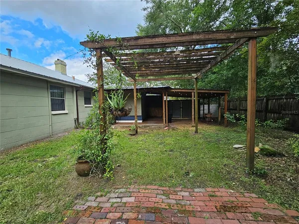 a view of a backyard with a swing