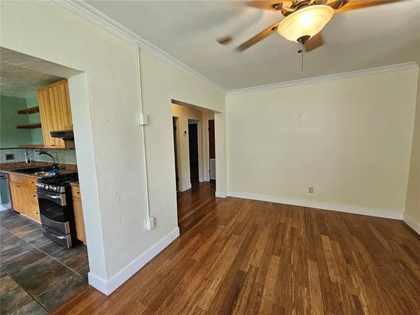 a view of a livingroom with wooden floor