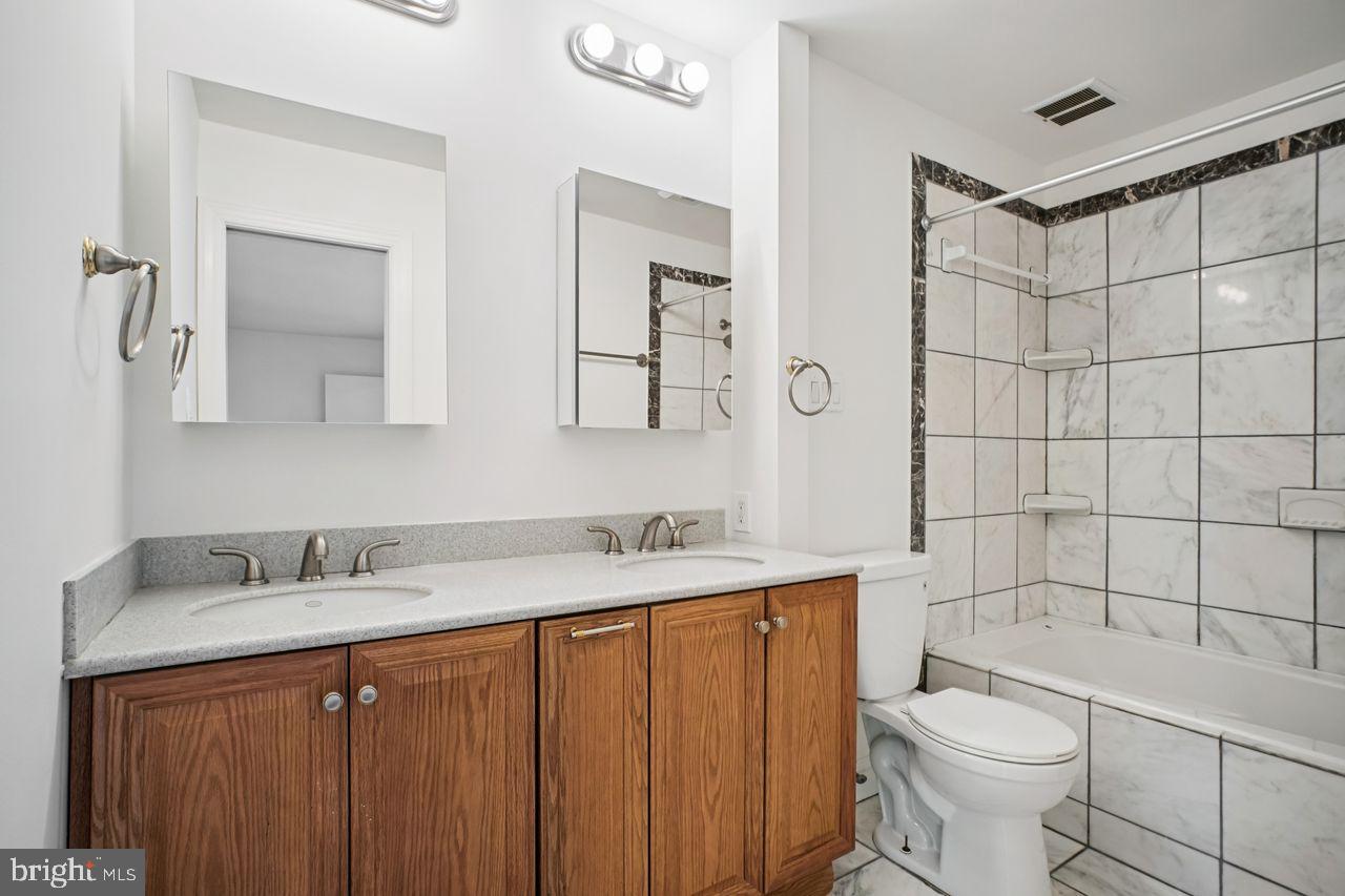 5105 Overlook Park Annandale, VA 22003 - Photo 17 of 32 a bathroom with a sink a toilet and shower