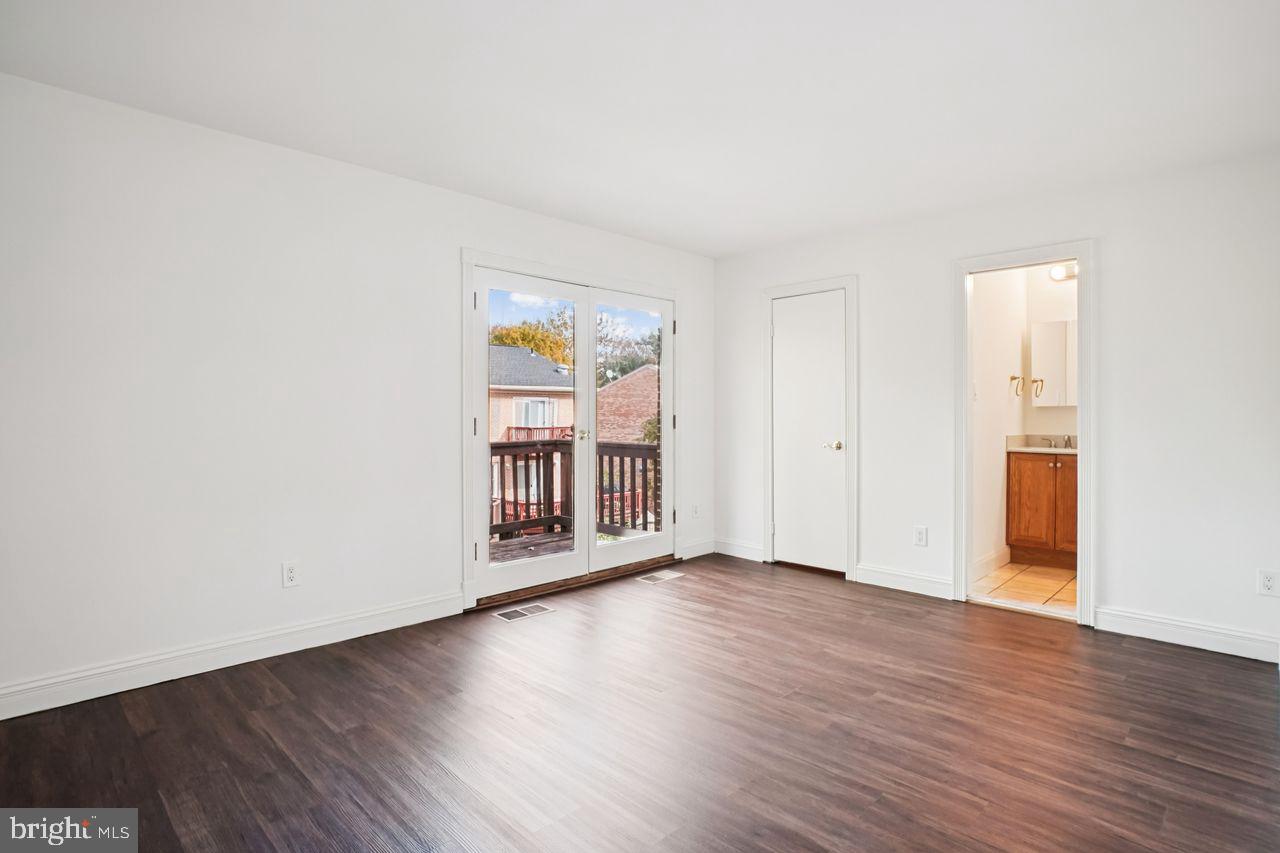 5105 Overlook Park Annandale, VA 22003 - Photo 18 of 32 an empty room with wooden floor and windows