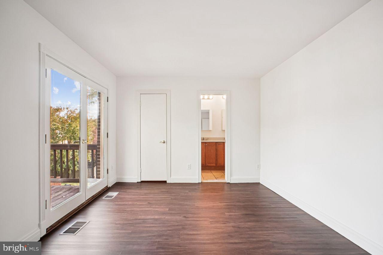 5105 Overlook Park Annandale, VA 22003 - Photo 19 of 32 a view of an empty room with wooden floor and a window