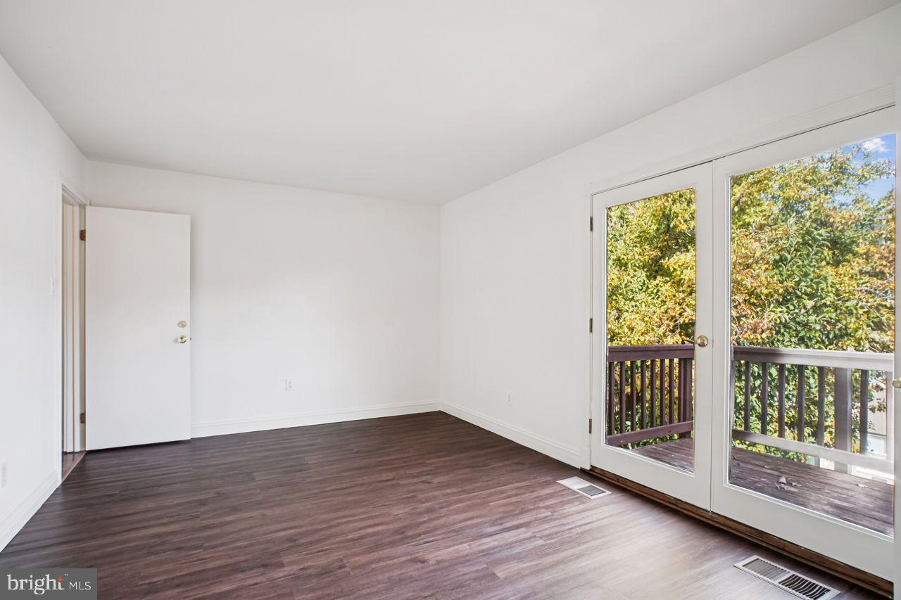 5105 Overlook Park Annandale, VA 22003 - Photo 20 of 32 a view of an empty room with wooden floor and a window