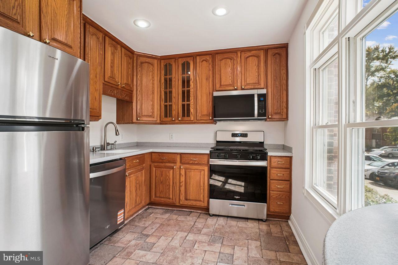 5105 Overlook Park Annandale, VA 22003 - Photo 2 of 32 a kitchen with stainless steel appliances granite countertop a refrigerator stove and sink