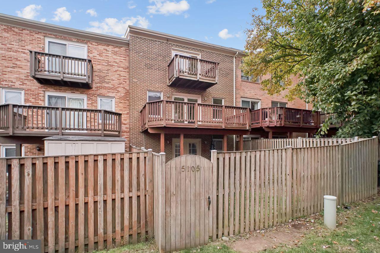 5105 Overlook Park Annandale, VA 22003 - Photo 28 of 32 a view of a brick house with wooden fence