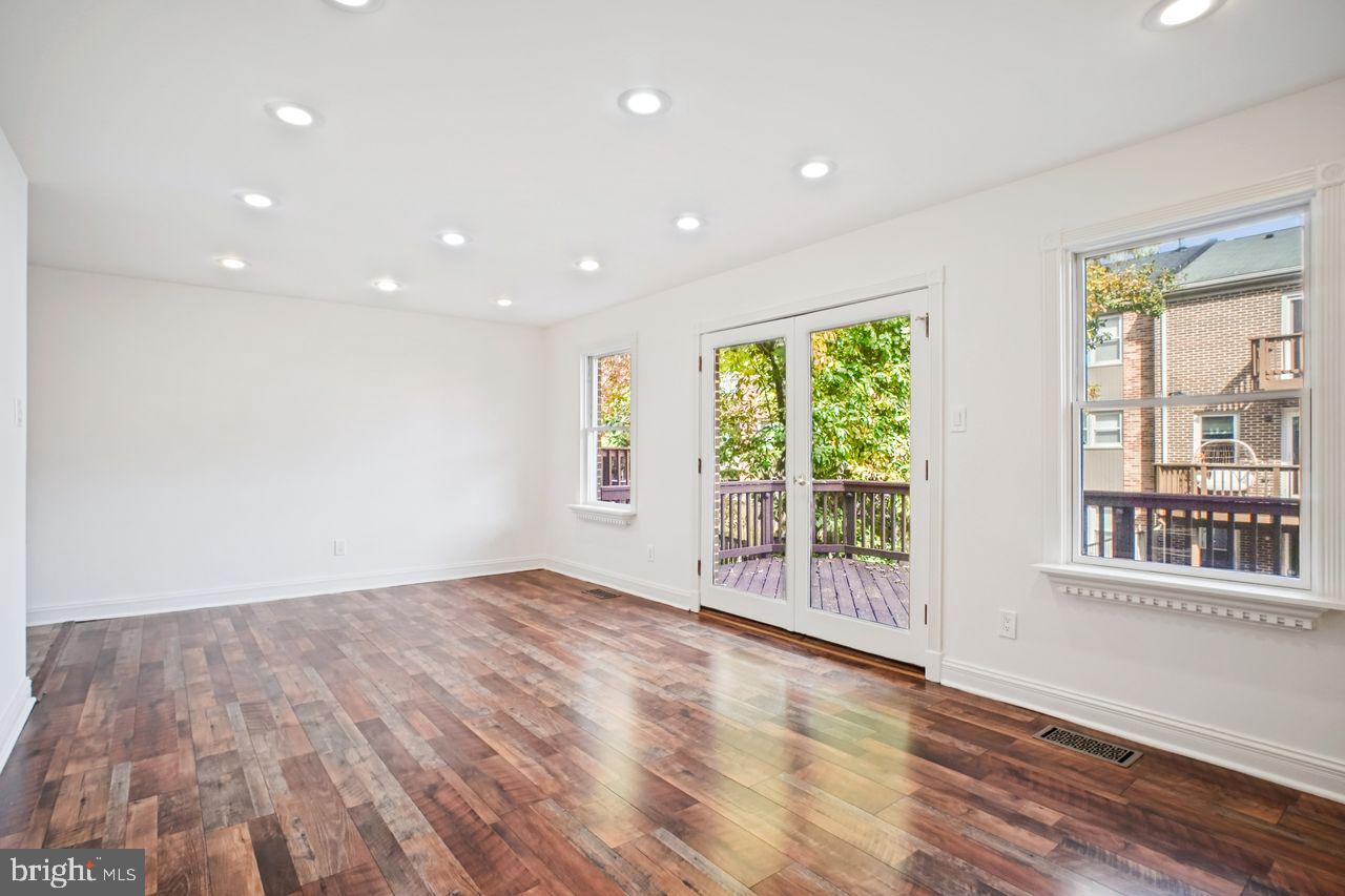 5105 Overlook Park Annandale, VA 22003 - Photo 4 of 32 a view of an empty room with wooden floor and a window