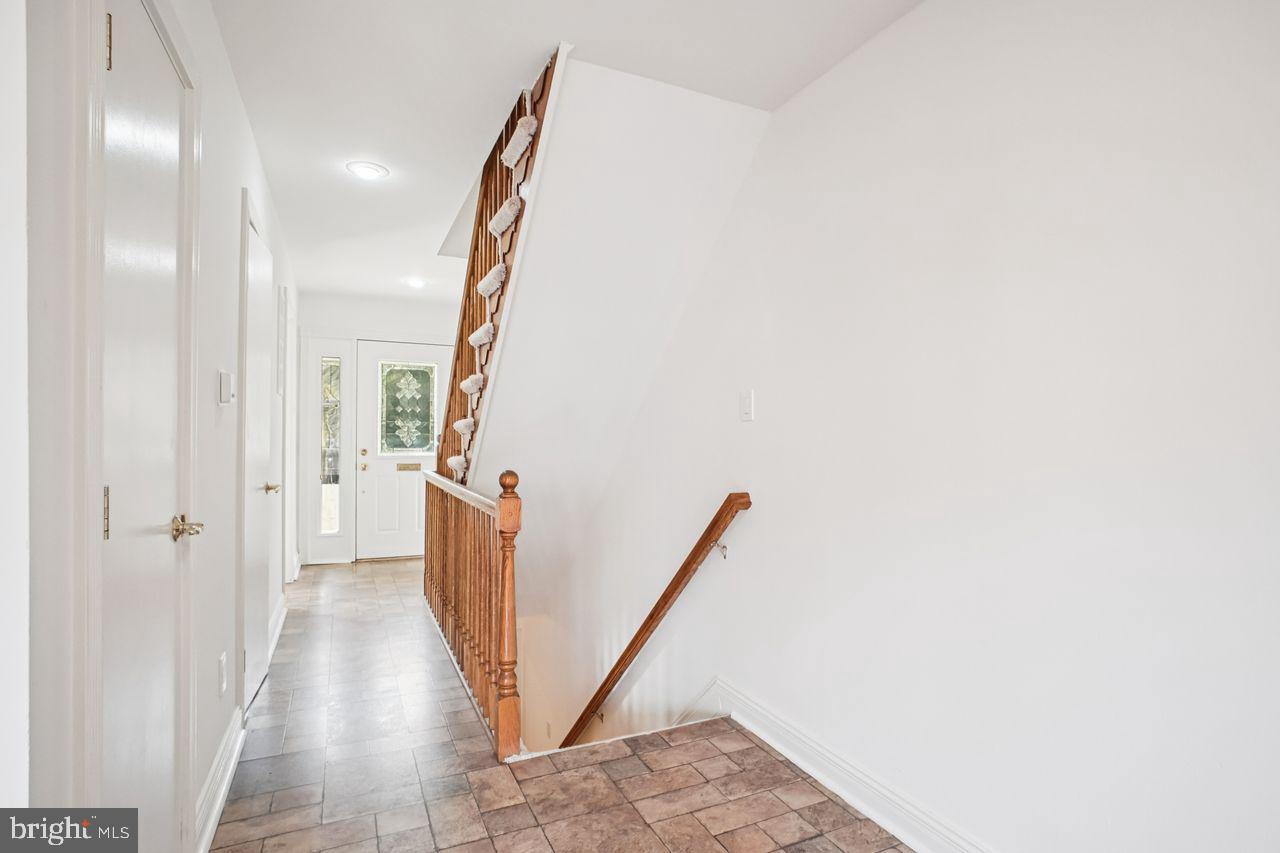 5105 Overlook Park Annandale, VA 22003 - Photo 9 of 32 a view of a hallway with wooden floor and staircase
