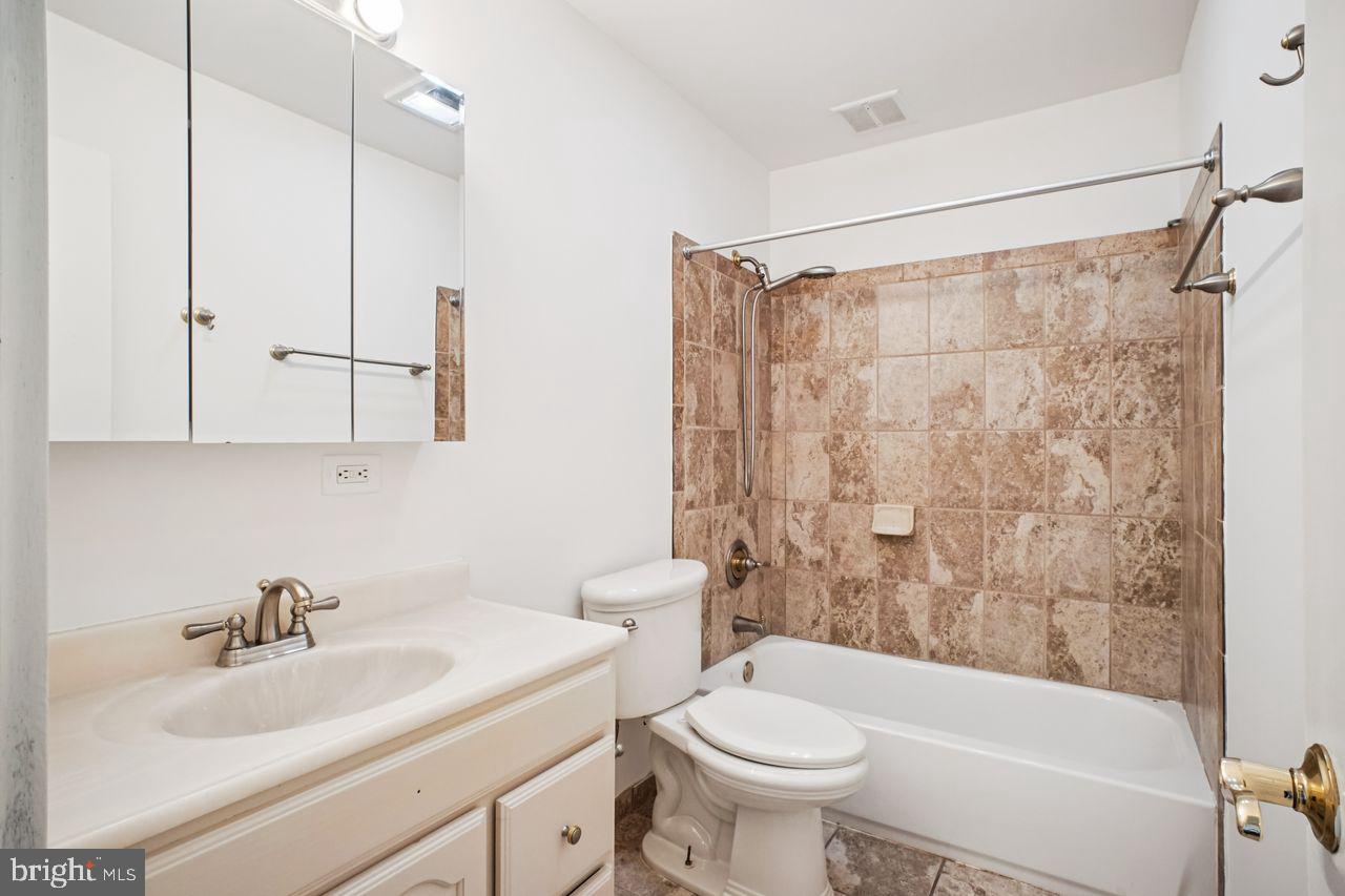 5105 Overlook Park Annandale, VA 22003 - Photo 10 of 32 a bathroom with a sink toilet and shower