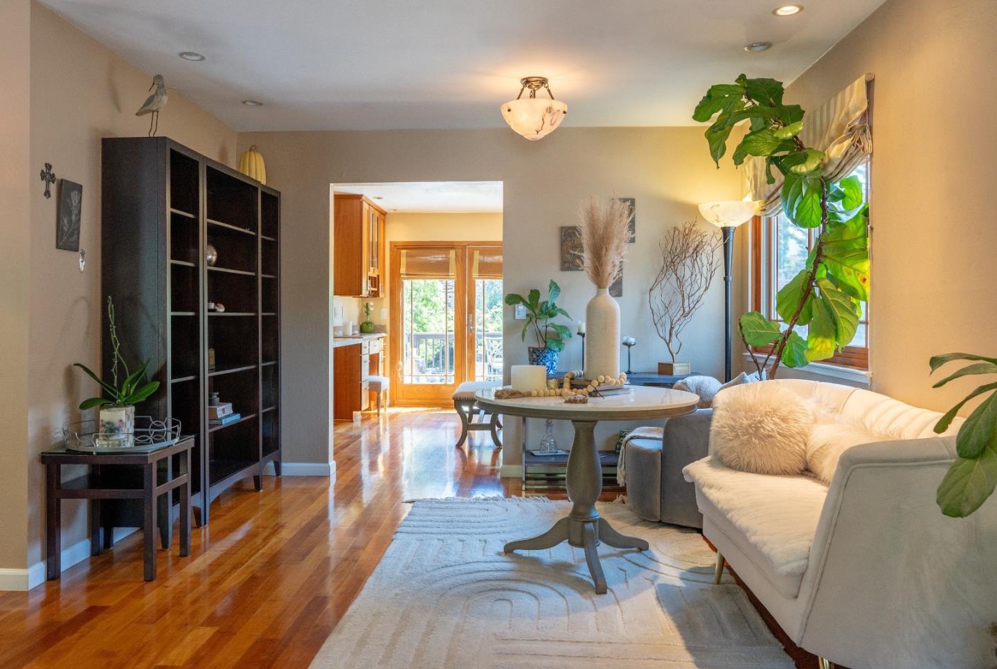 815 Cape Breton Drive Pacifica, CA 94044 - Photo 14 of 65 a living room with furniture a bookshelf and a window
