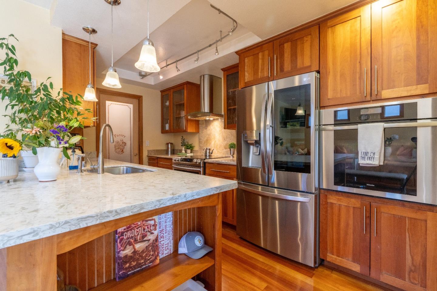 815 Cape Breton Drive Pacifica, CA 94044 - Photo 23 of 65 a kitchen with stainless steel appliances granite countertop a refrigerator a stove and a wooden cabinets