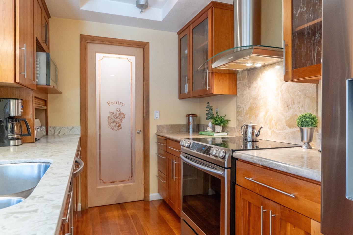 815 Cape Breton Drive Pacifica, CA 94044 - Photo 26 of 65 a kitchen with stainless steel appliances granite countertop a sink stove and refrigerator