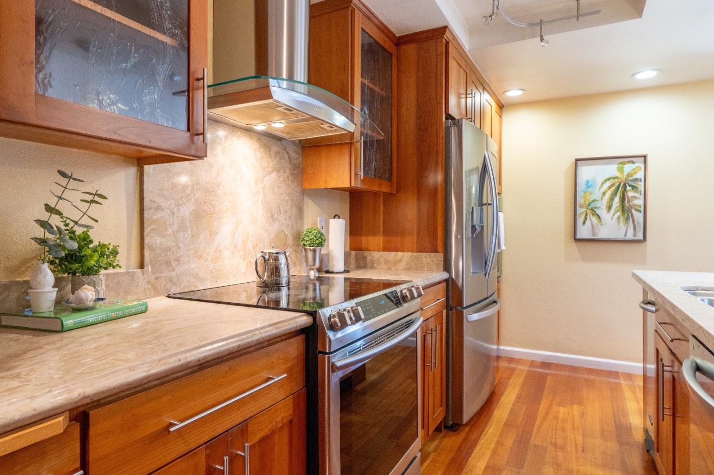 815 Cape Breton Drive Pacifica, CA 94044 - Photo 28 of 65 a kitchen with stainless steel appliances granite countertop a sink stove and cabinets