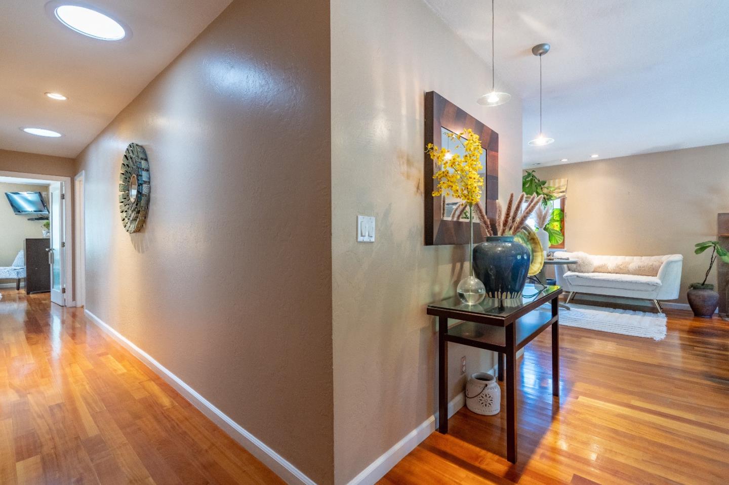 815 Cape Breton Drive Pacifica, CA 94044 - Photo 29 of 65 a living room with furniture and a wooden floor