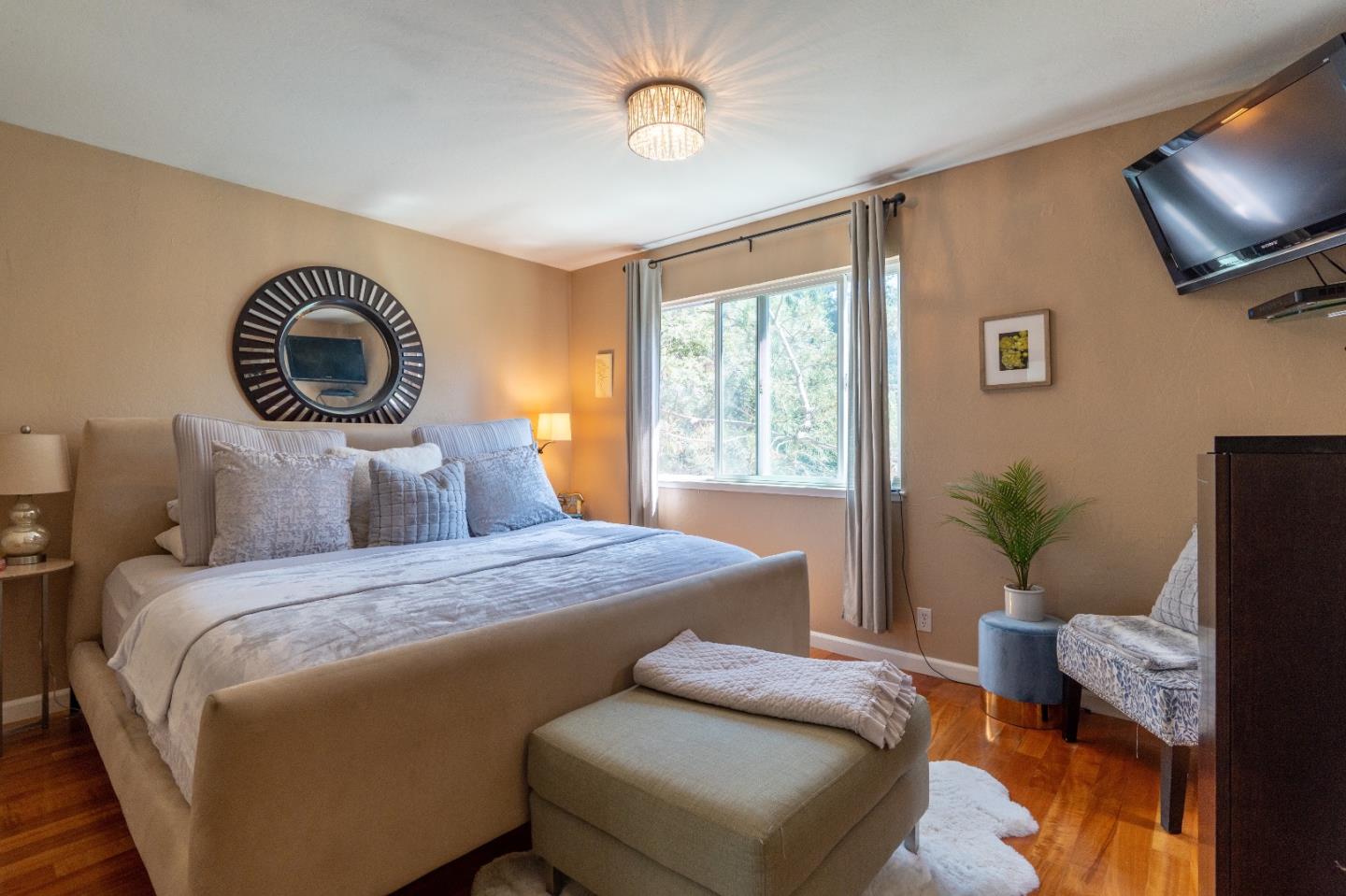 815 Cape Breton Drive Pacifica, CA 94044 - Photo 34 of 65 a bedroom with a bed and a chair