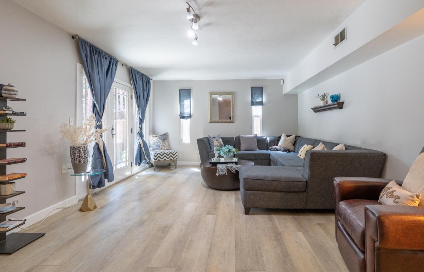 815 Cape Breton Drive Pacifica, CA 94044 - Photo 40 of 65 a living room with furniture a couch and a window