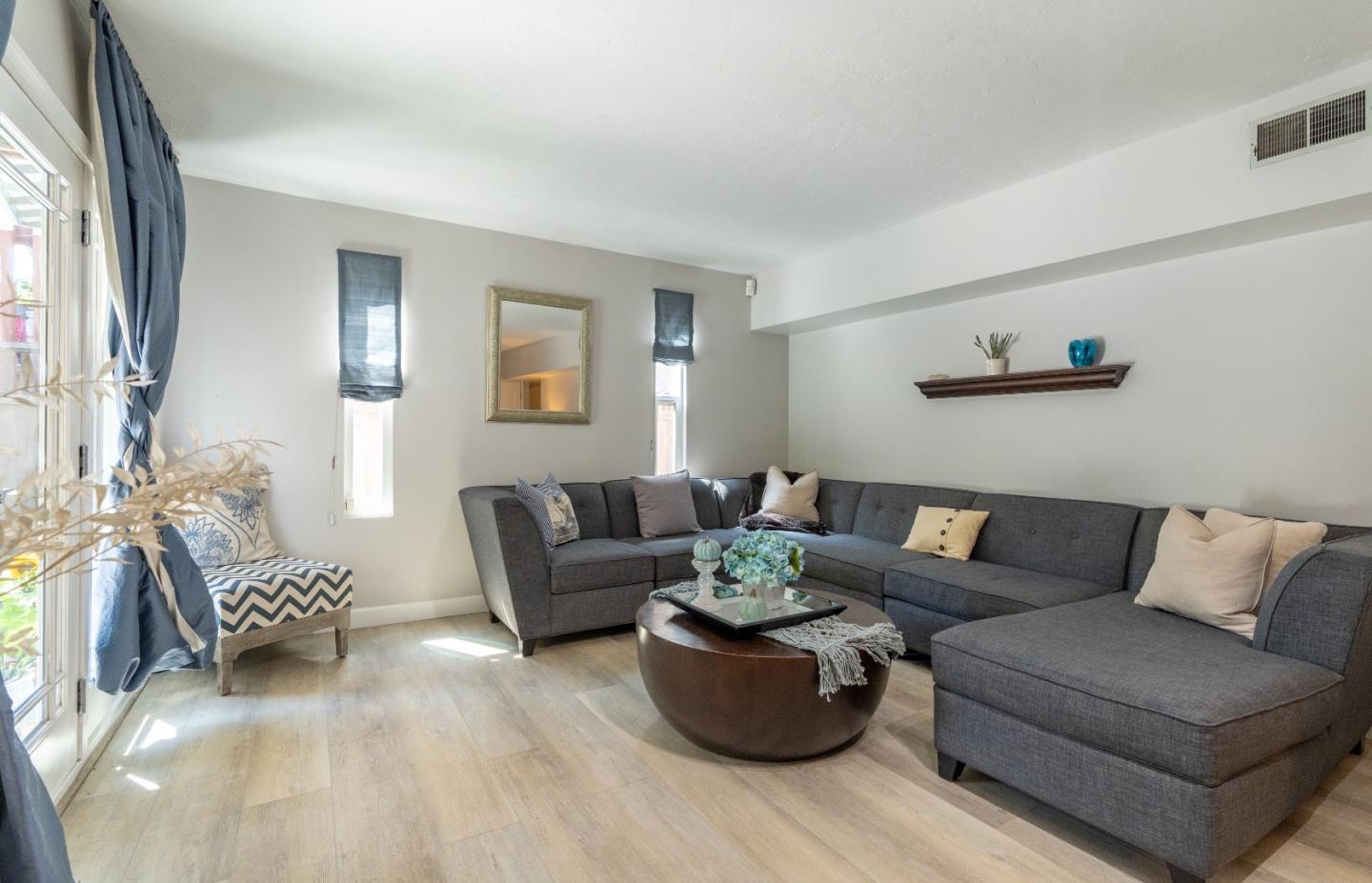 815 Cape Breton Drive Pacifica, CA 94044 - Photo 41 of 65 a living room with furniture or couch and a window