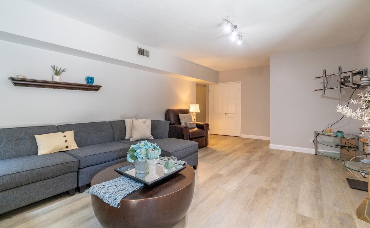 815 Cape Breton Drive Pacifica, CA 94044 - Photo 42 of 65 a living room with furniture and wooden floor