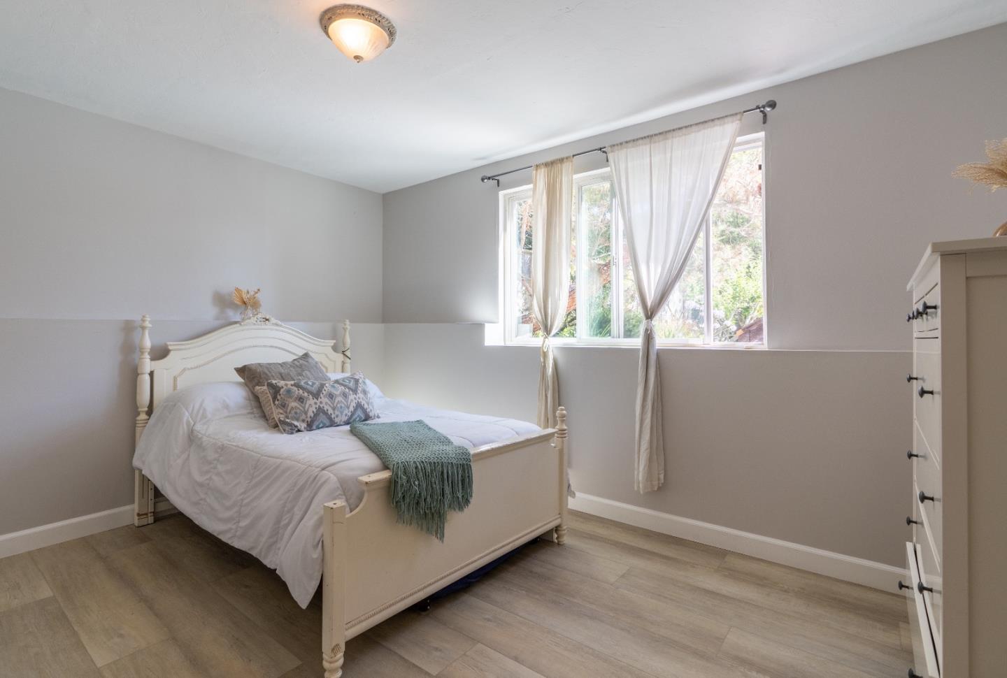 815 Cape Breton Drive Pacifica, CA 94044 - Photo 44 of 65 a bedroom with a bed and window