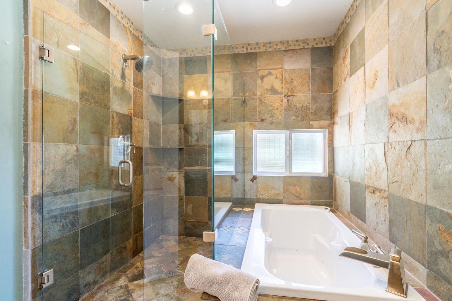 815 Cape Breton Drive Pacifica, CA 94044 - Photo 46 of 65 a bathroom with a tub shower and sink