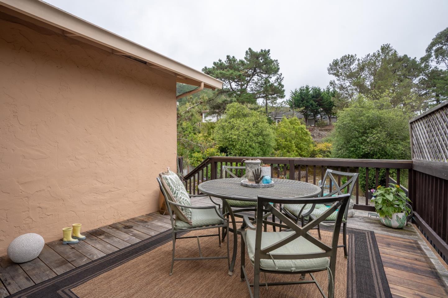 815 Cape Breton Drive Pacifica, CA 94044 - Photo 48 of 65 a balcony with wooden floor table and chairs