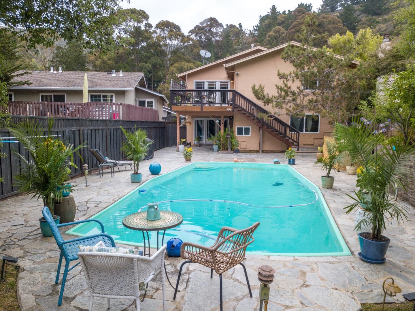 815 Cape Breton Drive Pacifica, CA 94044 - Photo 50 of 65 a backyard of a house with table and chairs