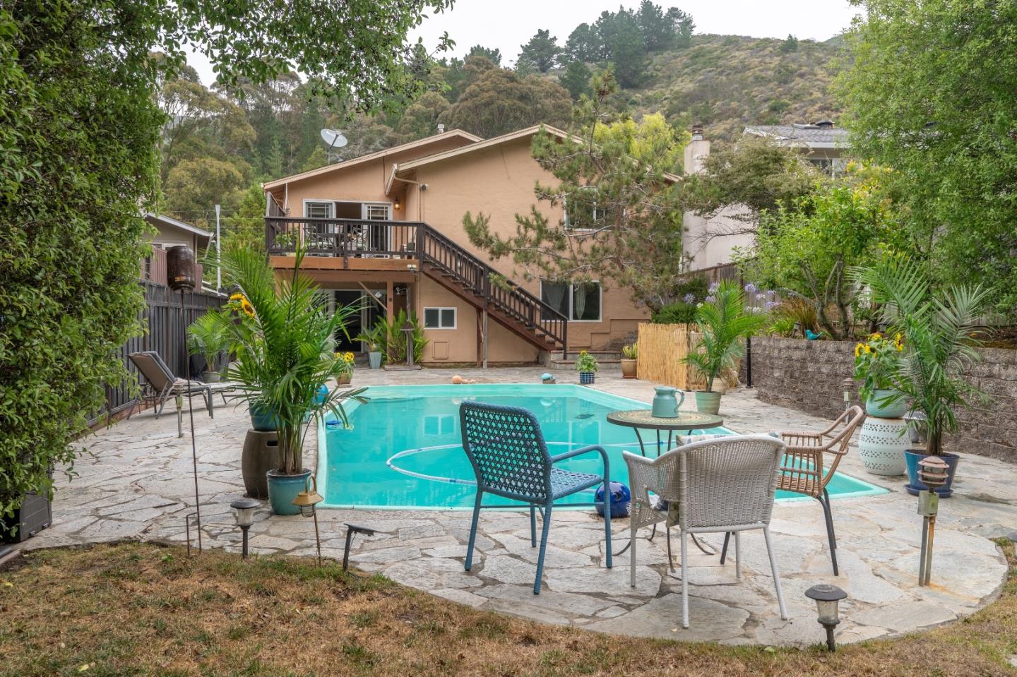 815 Cape Breton Drive Pacifica, CA 94044 - Photo 51 of 65 a view of a chair and table in backyard